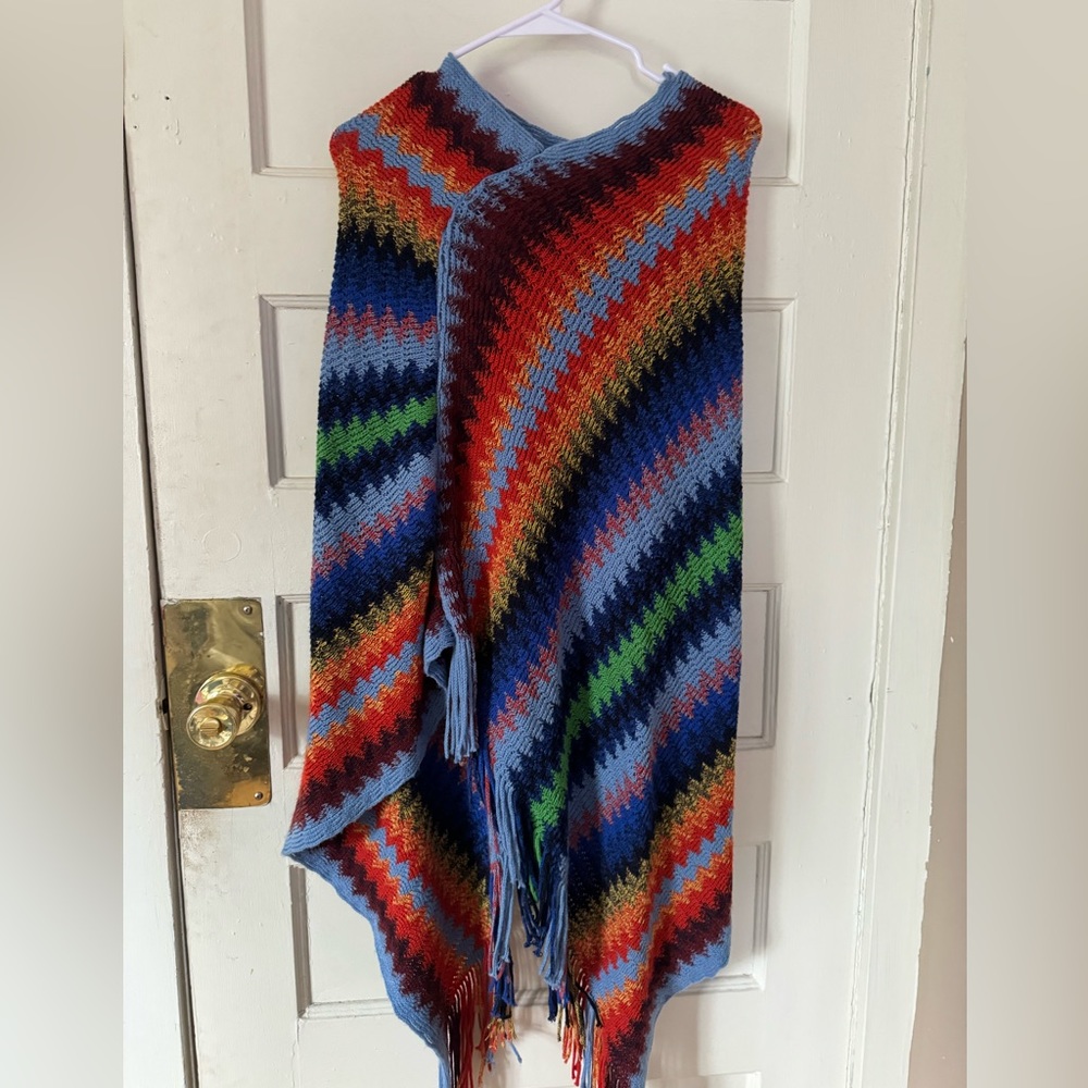 rainbow colored poncho! it’s so so cute and soft.